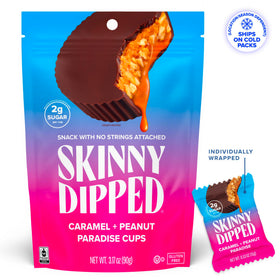Cross-section of SKINNYDIPPED cup with peanut butter center and caramel layer.