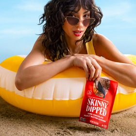SkinnyDipped resealable bags shown for fresh on-the-go snacking.