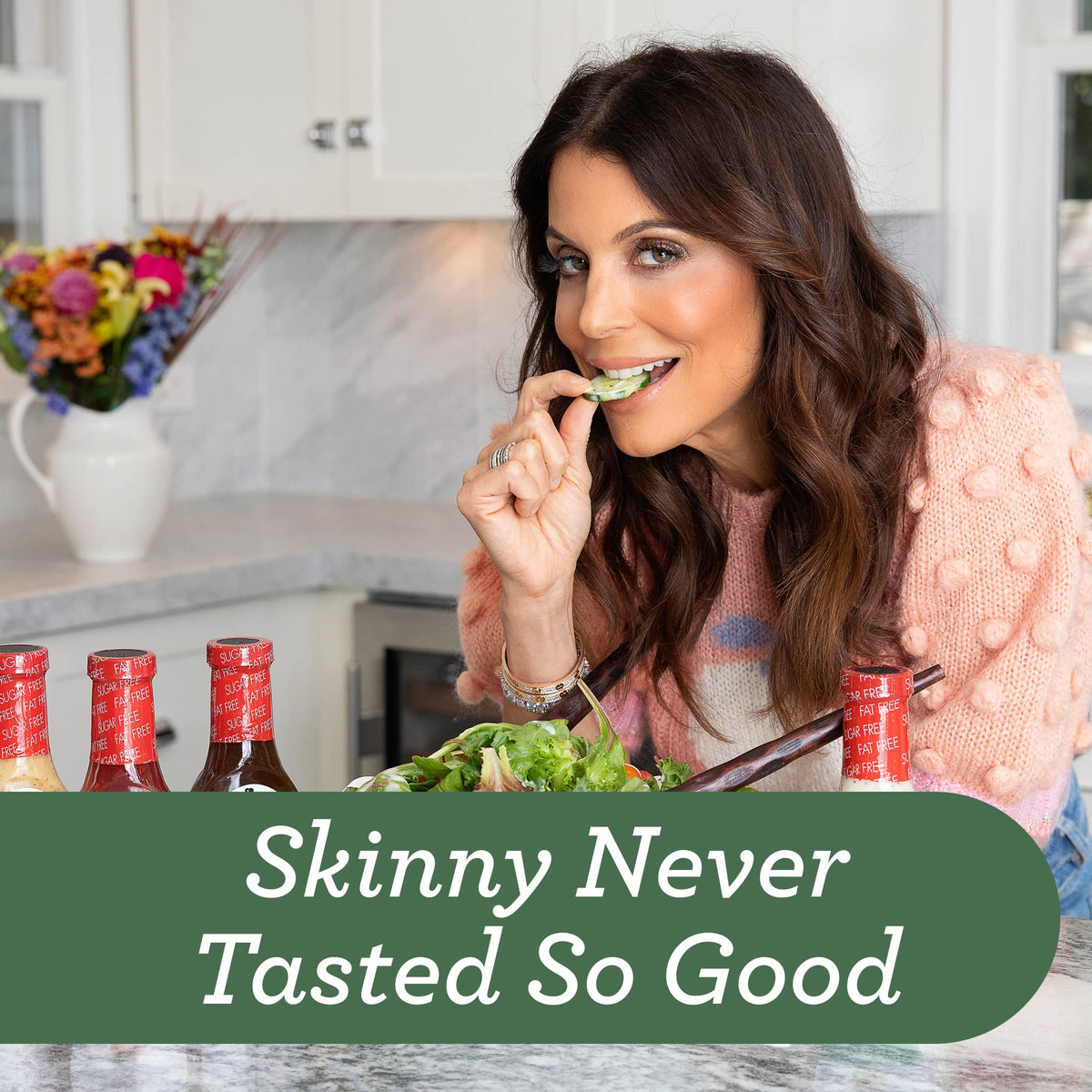 Pouring Skinnygirl Poppyseed dressing over a fresh salad.