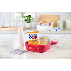 SkinnyPop lunchbox shot emphasizes convenient, kid-friendly dairy-free option for school days.