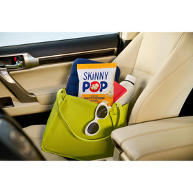 SkinnyPop White Cheddar bag closeup showcases crisp texture and cheddar flavor without artificial colors.