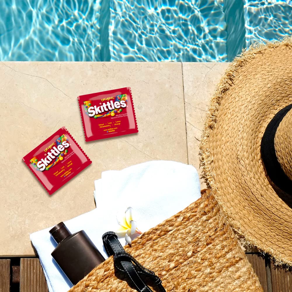 Clear packaging reveals vibrant Skittles pouches inside