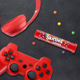 Skittles Littles arranged on a desk for quick mood-boosting bites.