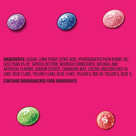 Skittles Sours Wild Berry candies spilling from a resealable package.