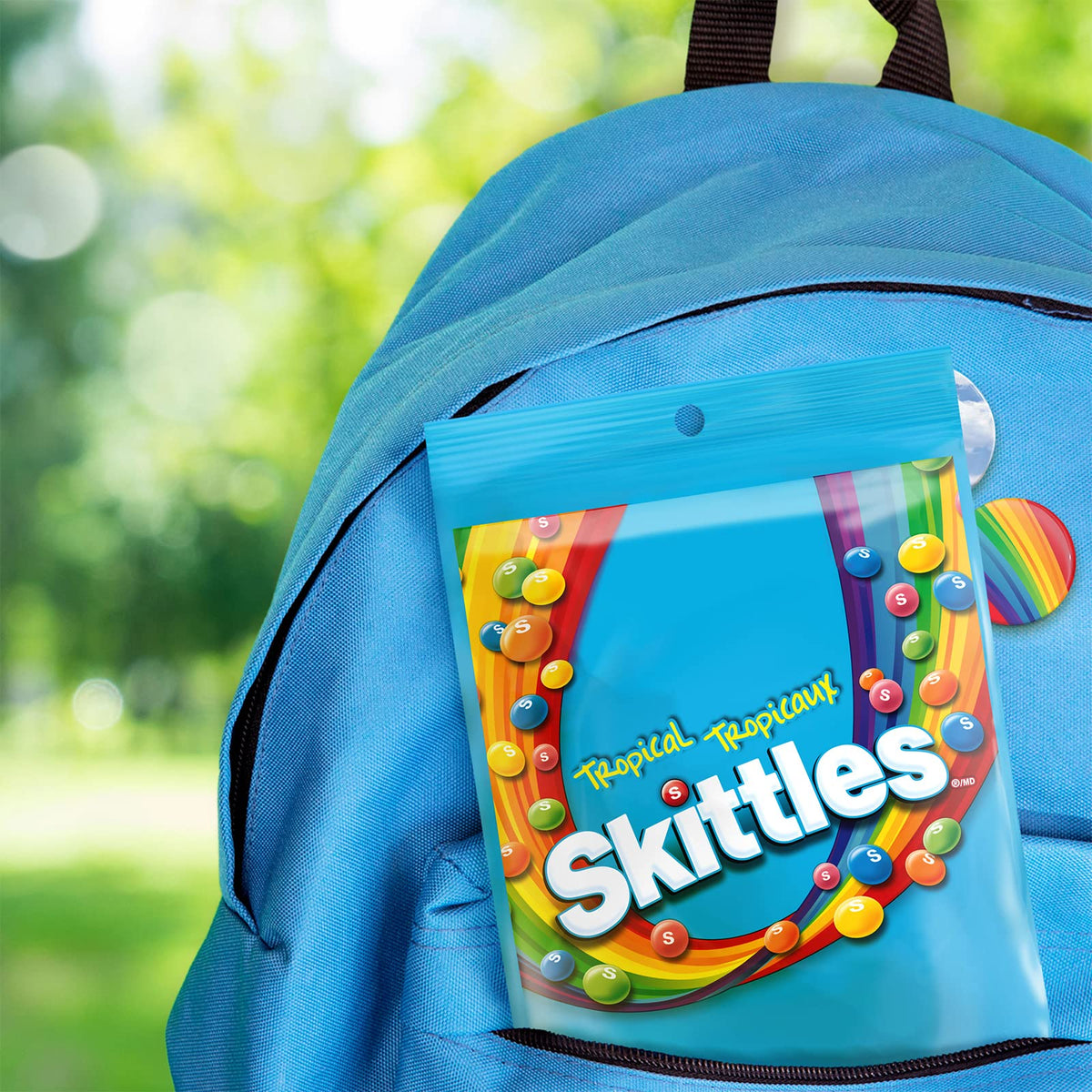 Skittles Tropical bag pouring colorful candies for party snacking