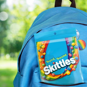 Skittles Tropical bag pouring colorful candies for party snacking