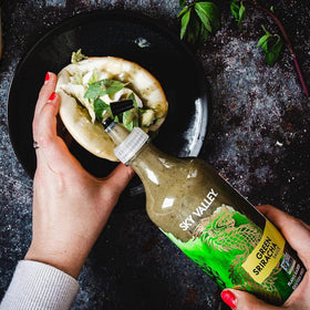 Sky Valley Green Sriracha pairs with nachos for fresh heat.