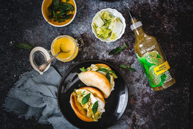 Sky Valley Sriracha bottle on shelf; travel-friendly heat in your pantry