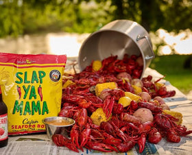 Slap Ya Mama Cajun boil spice on kitchen counter during party.