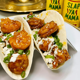 Aromas rise as SLAP YA MAMA seasons vegetables for a fresh taste.