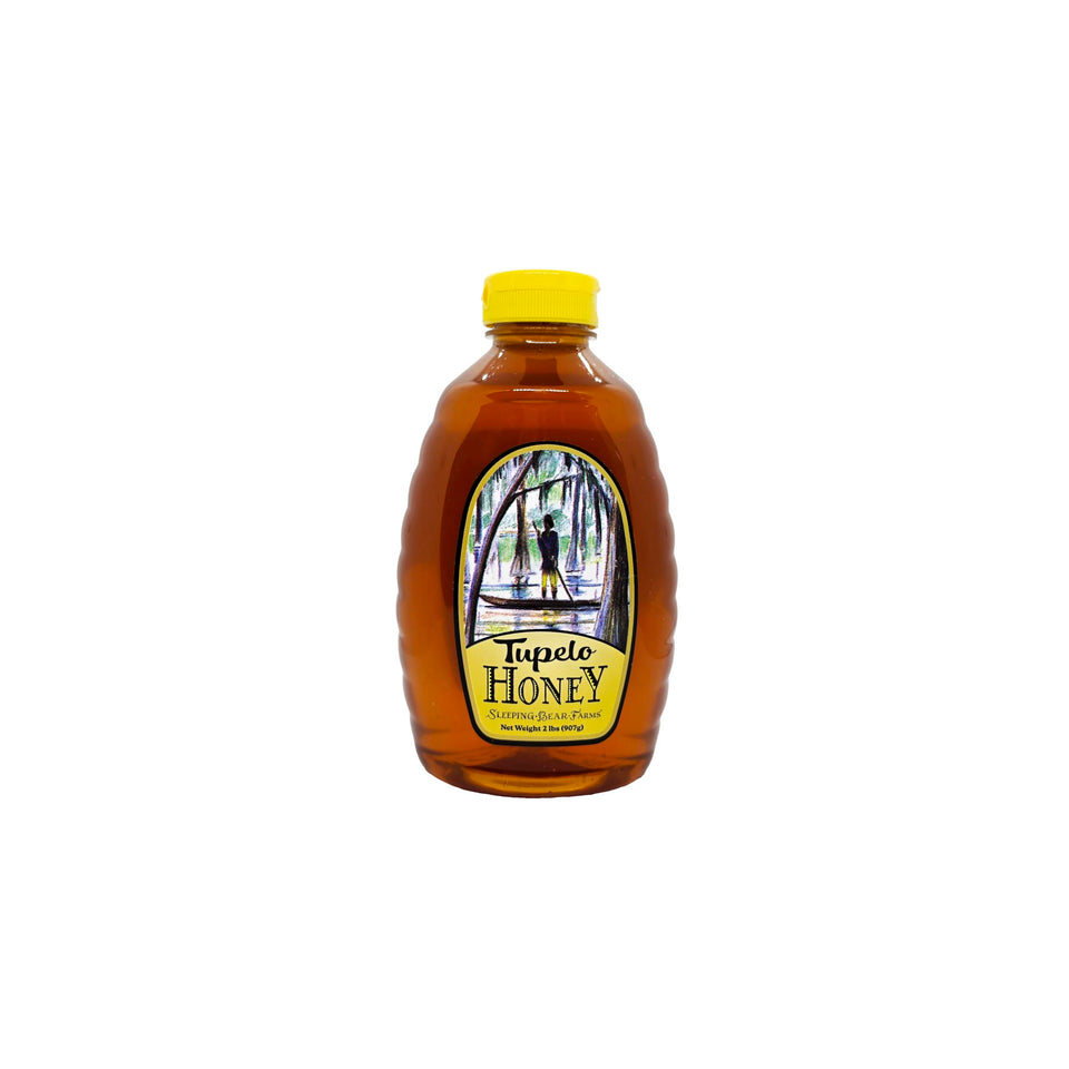 Sleeping Bear Farms Tupelo honey bottle pour, enhances tea and toast with buttery finish.