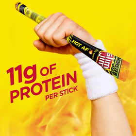 Slim Jim Monster Hot AF stick in hand for on-the-go fuel.