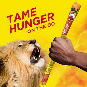 Slim Jim Monster Teriyaki stick held in hand for quick bite