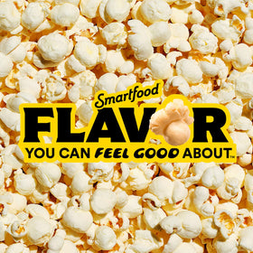 Smartfood White Cheddar popcorn on kitchen counter, ready for quick snacking.