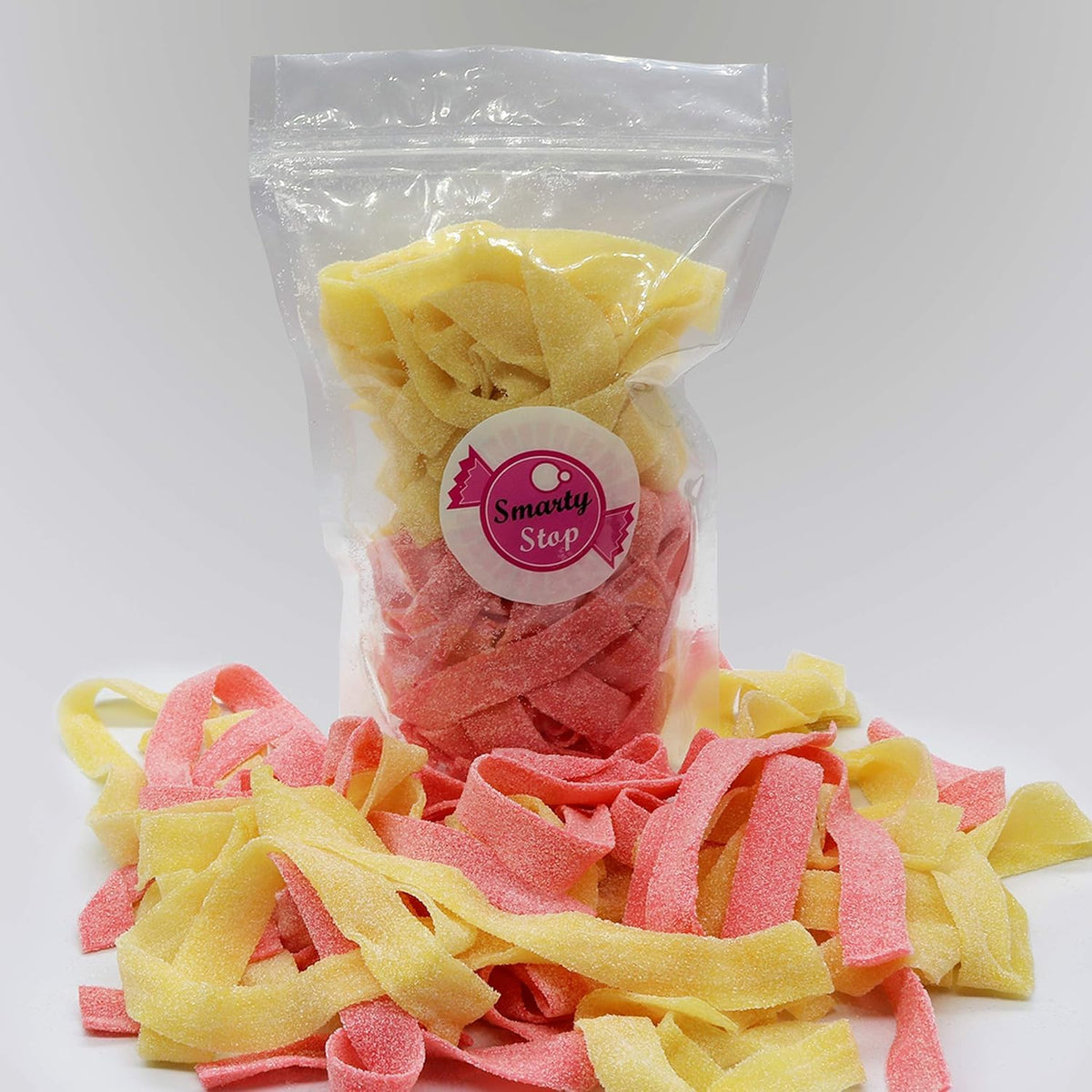 Smarty Stop Sour Every Flavor Mixed Gummy Belts mango close-up, tangy on-the-go snack.