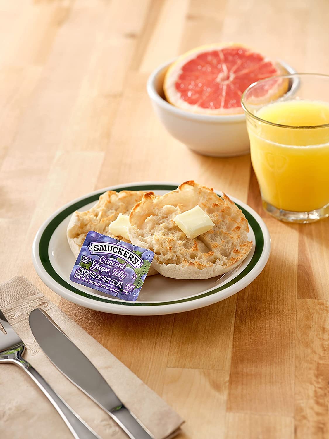 Smucker's apple jelly half-ounce cups showcased, great for family breakfasts or catering.