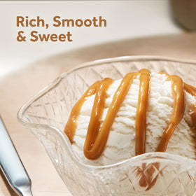 Smucker’s Drizzle caramel syrup poured over ice cream and cheesecake