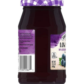 Smucker's Low Sugar Concord Grape Jelly label close-up showing reduced sugar claim.