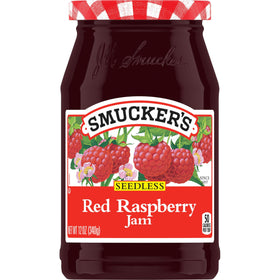 Smucker's Seedless Red Raspberry Jam jar shows seedless texture for easy spreading.