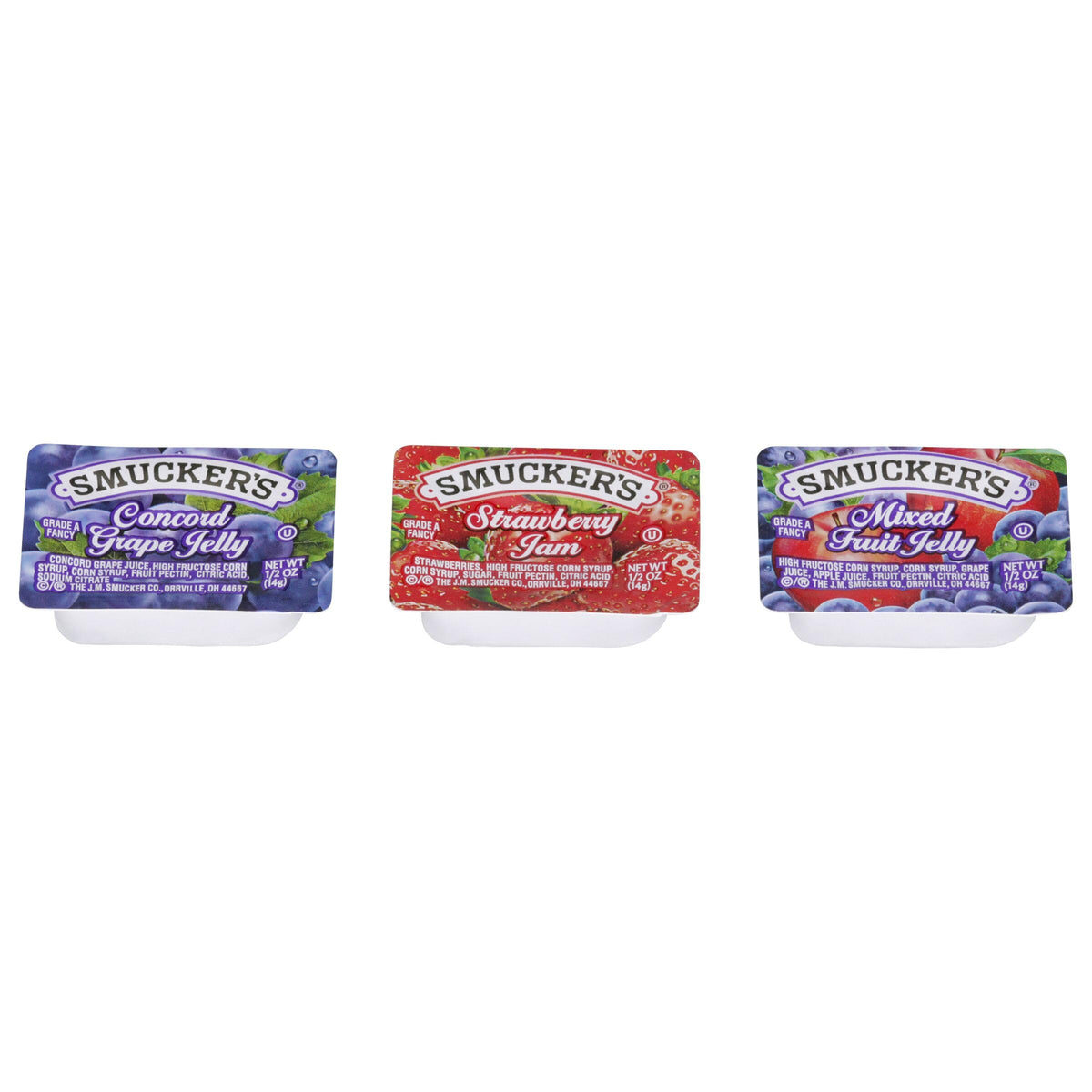 Top view of Smucker's strawberry jam half-ounce cups in display.