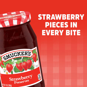 Close-up of strawberry chunks in Smucker's preserves, perfect for glaze or topping.