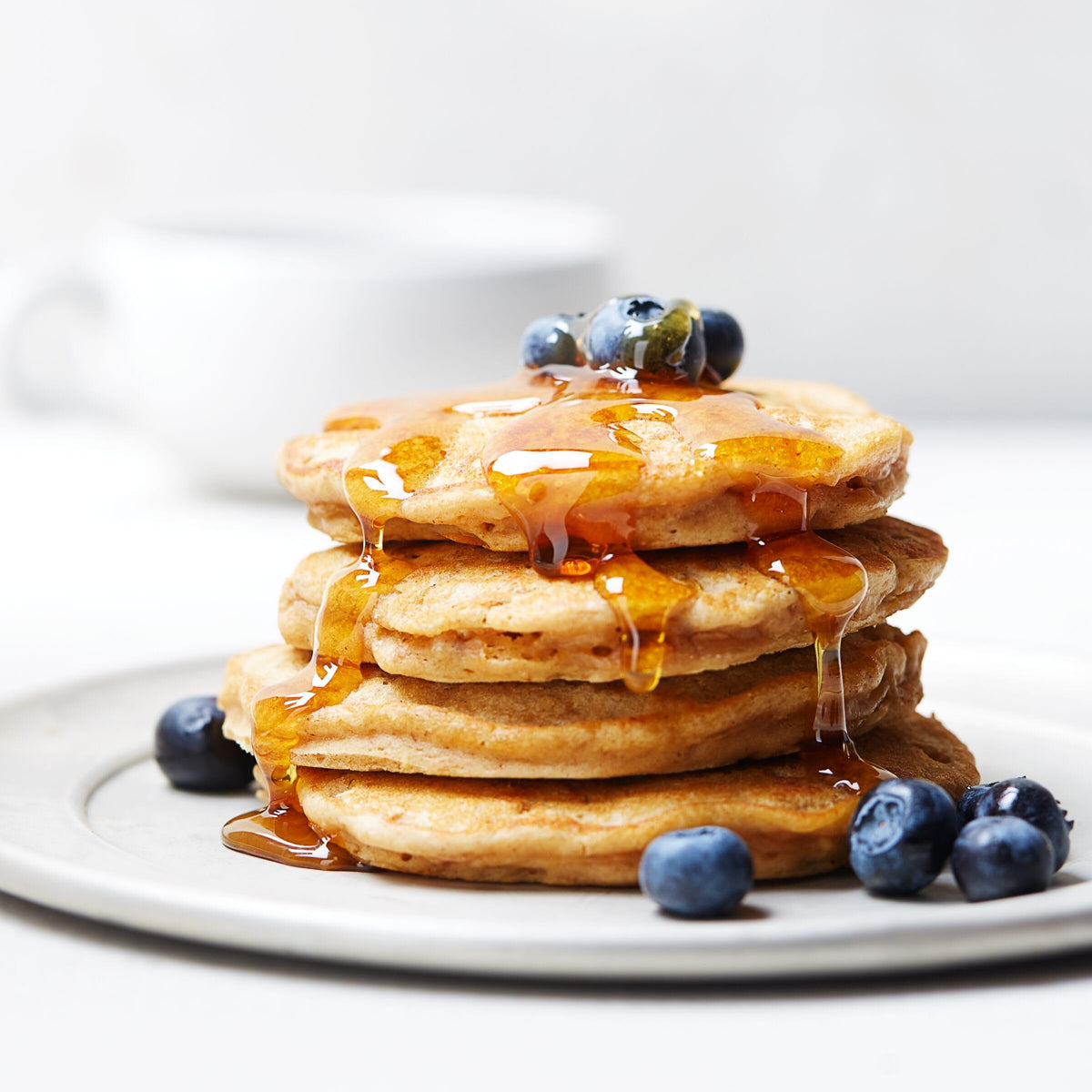 Smucker's Sugar Free Breakfast Syrup portion cups on a caddy, tidy service presentation.
