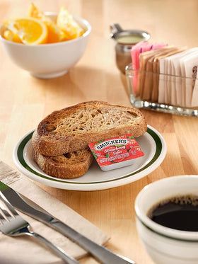 Smucker's tabletop caddy display highlighting three flavors for guests.
