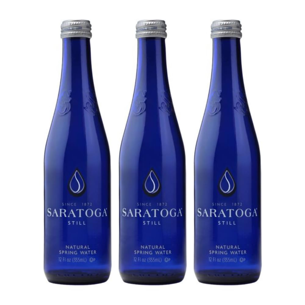 Snack Mass Saratoga Still Water in a glass bottle, premium hydration on the go.