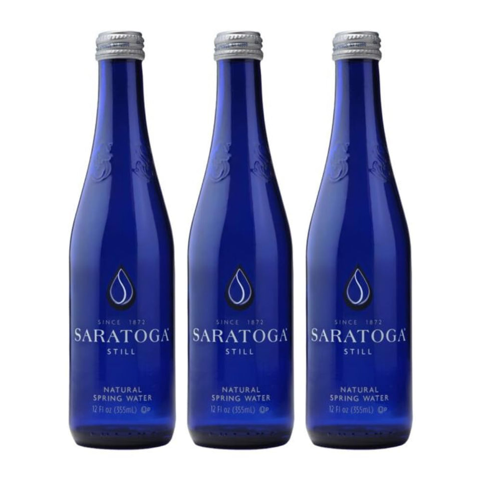 Snack Mass Saratoga Still Water in a glass bottle, premium hydration on the go.