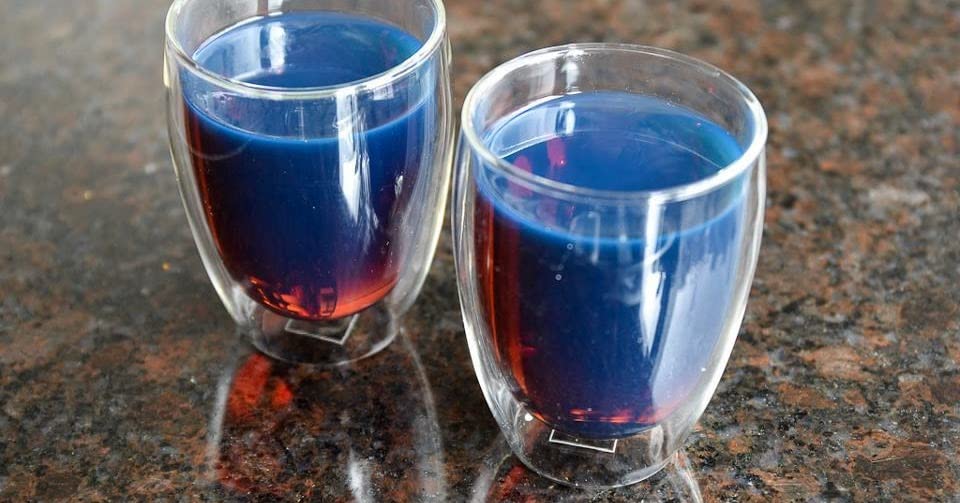 Snackadilly Blue Stick Tea brew with a delicate blue tint atop a rich cup