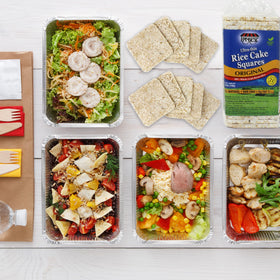 SNACKTERY Ultra Thin Rice Cakes salted on slate, perfect base for spreads.