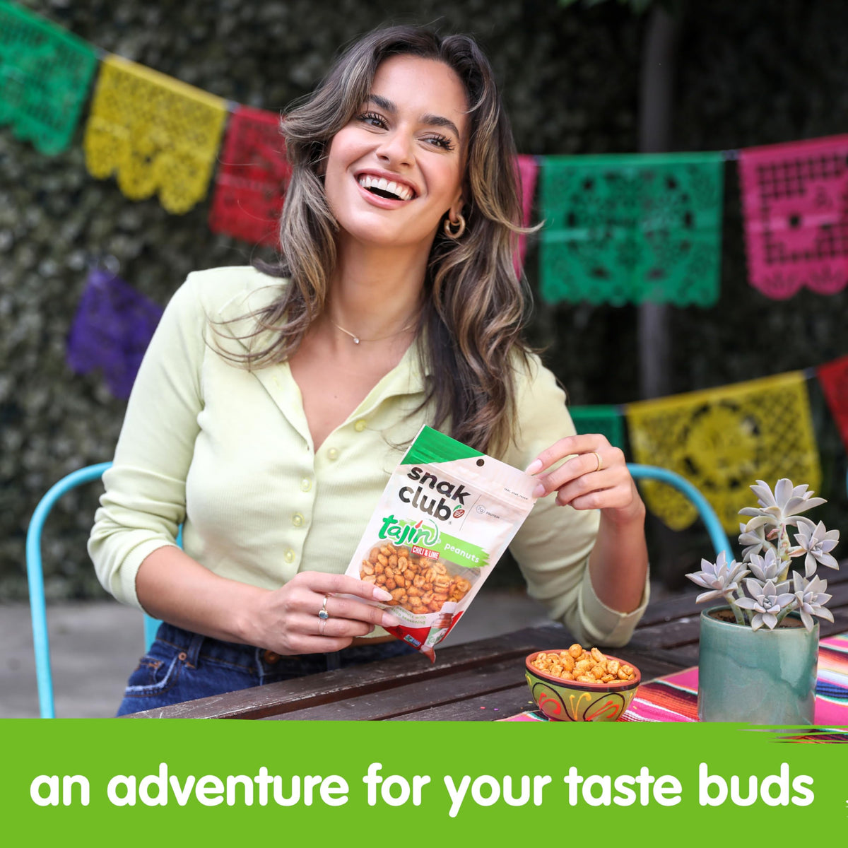 Snak Club Tajin Peanuts display multi-pack for sharing at gatherings.