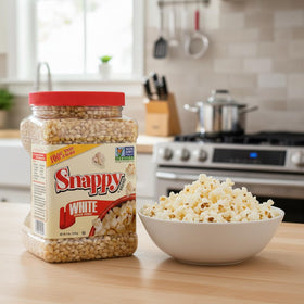 SNAPPY White Popcorn packaging highlights gluten-free, non-GMO kernels.