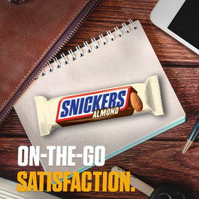 Office breakroom snack: Snickers Almond Bars on desk