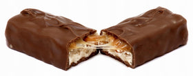 Snickers bars stacked, individually wrapped for convenient sharing.
