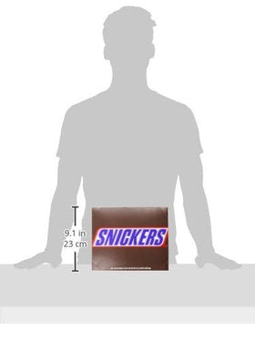Snickers bar cross-section reveals the peanut-nougat-caramel layers.