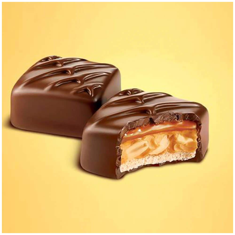 Snickers Peanut Butter Squared ooey-gooey center close-up, showcasing chewy texture for a satisfying bite.