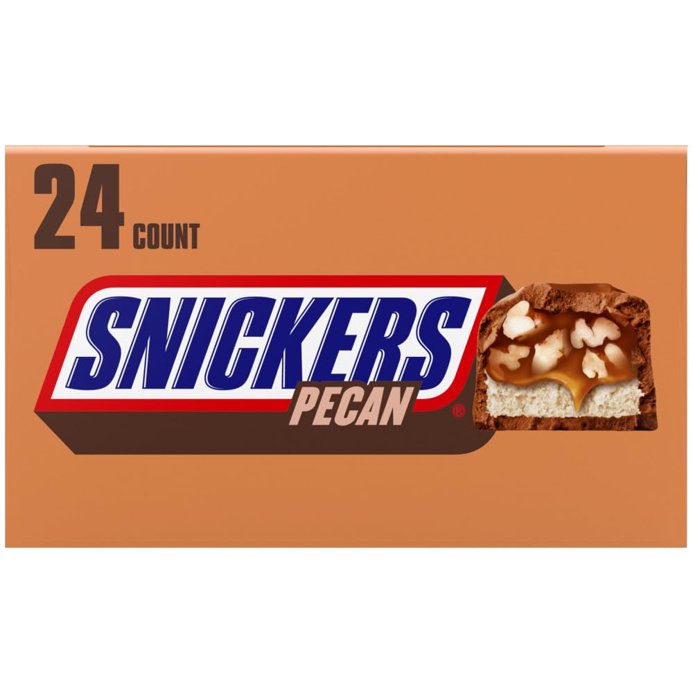 Cross-section of SNICKERS Pecan bar showing pecans, caramel, and nougat.