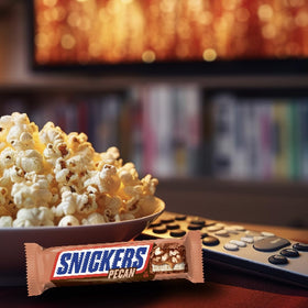 Halloween display featuring SNICKERS Pecan bars in a bulk pack.