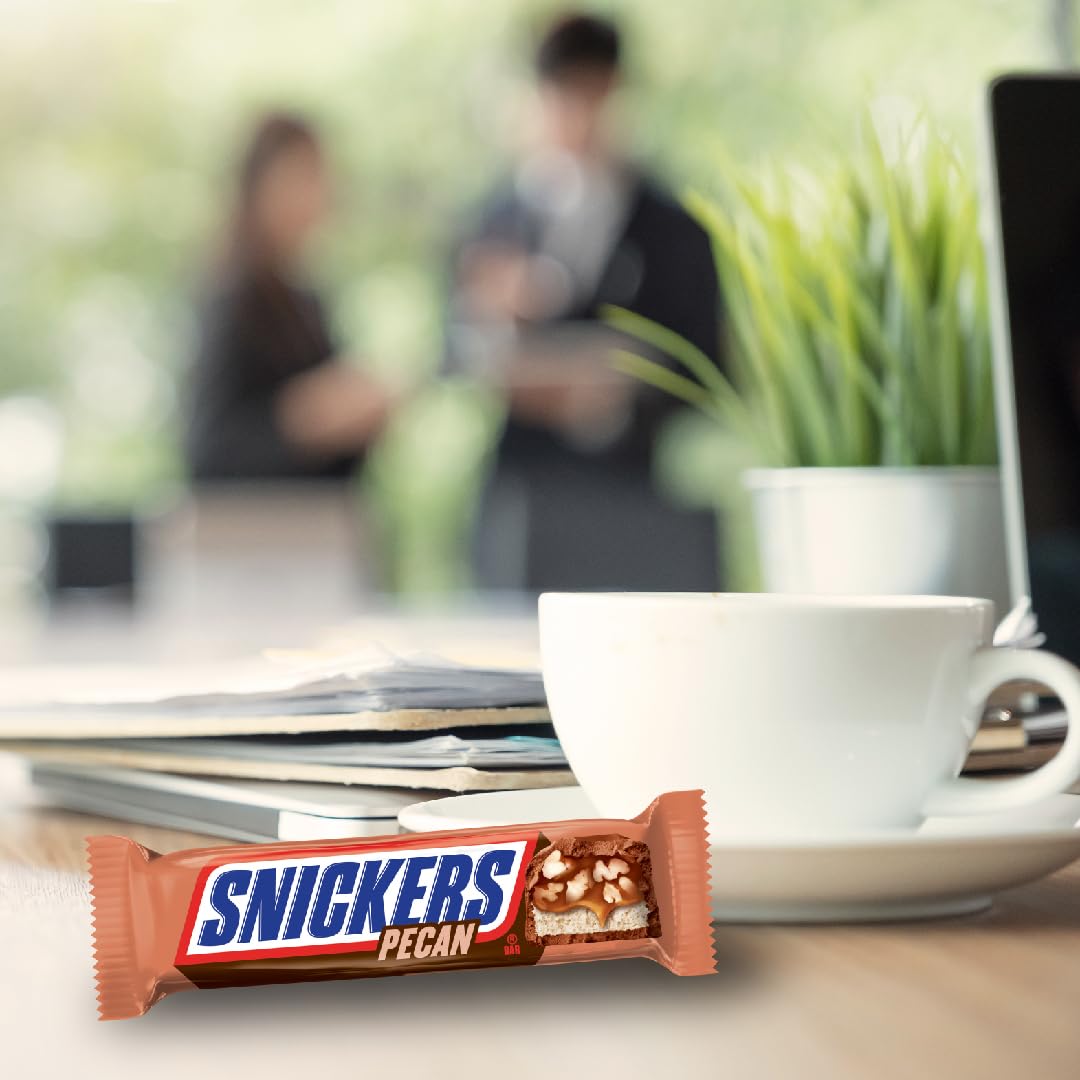 Movie night with SNICKERS Pecan milk chocolate bars for a sweet treat.