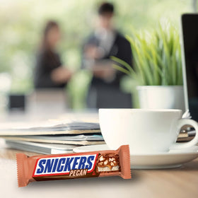 Movie night with SNICKERS Pecan milk chocolate bars for a sweet treat.