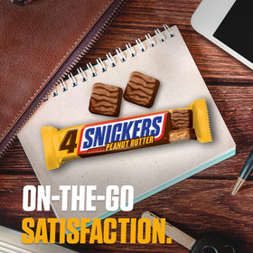 Snickers snack at work, a convenient office treat for hungry moments.