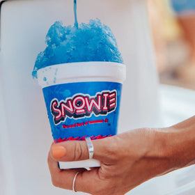 Snowie Tiger's Blood concentrate label on bottle showing brand and flavor.