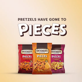 Snyder's of Hanover Hot Buffalo Wing Pretzel Pieces in motion for crunch