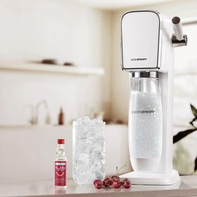 Pouring Bubly Drops Raspberry into sparkling water for a quick flavor boost.