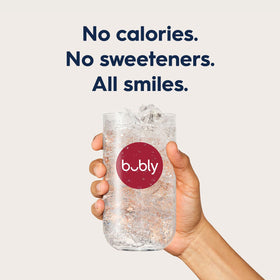 Close-up of Bubly Drops Raspberry dissolving in water for personalized taste.