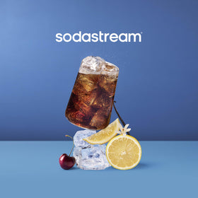 Sodastream Cola bottle being poured into a glass with bubbles