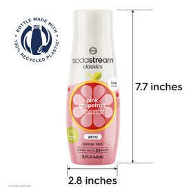 SodaStream Pink Grapefruit with fresh citrus beside a sparkling glass