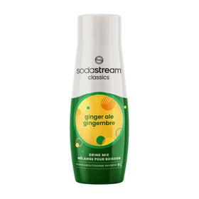 SodaStream Ginger Ale syrup bottle poured for a refreshing at-home soda.