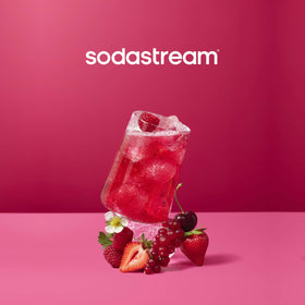 Pouring MTN Dew Code Red into sparkling water for a refreshing cherry twist.
